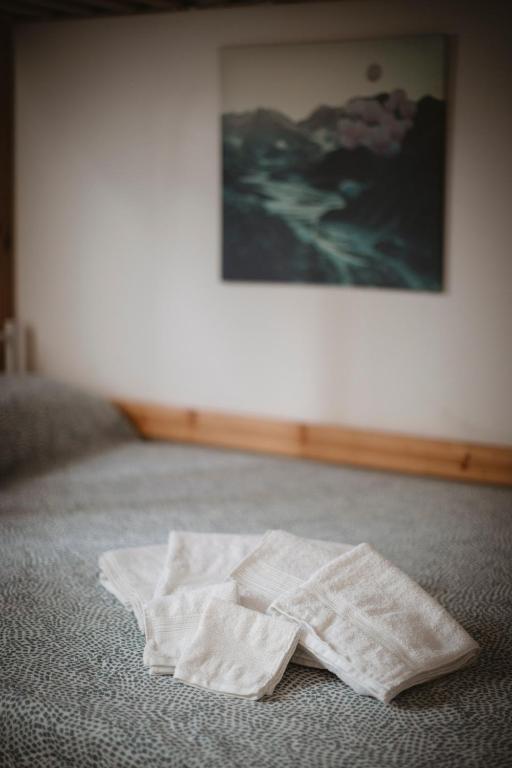 a pair of white towels laying on a bed at Villa Valentina Versilia in Viareggio