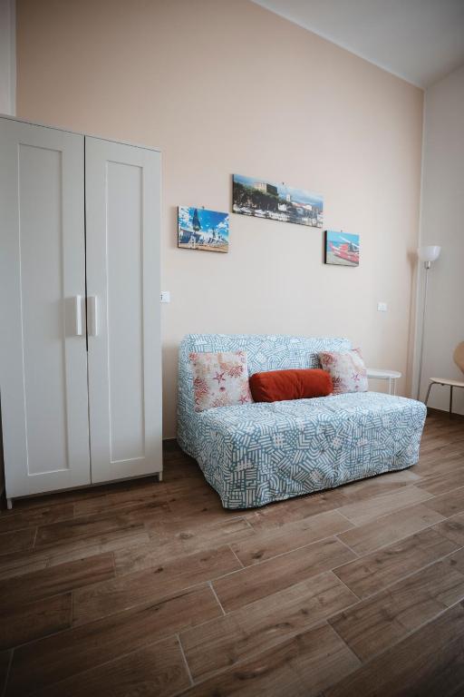 a living room with a couch in a room at Villa Valentina Versilia in Viareggio