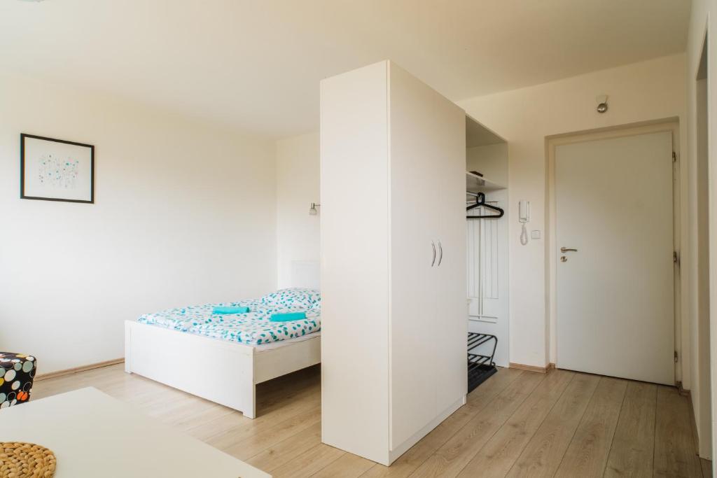 Postel nebo postele na pokoji v ubytování Apartmány Špička - Stříbrnice u sjezdovky