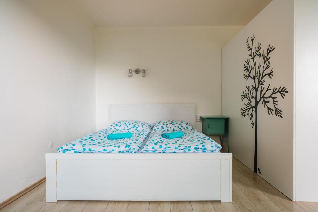Postel nebo postele na pokoji v ubytování Apartmány Špička - Stříbrnice u sjezdovky