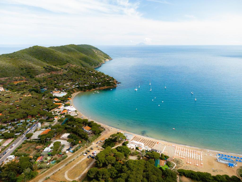 an aerial view of a beach with boats in the water at Glamping at Elba in Lacona