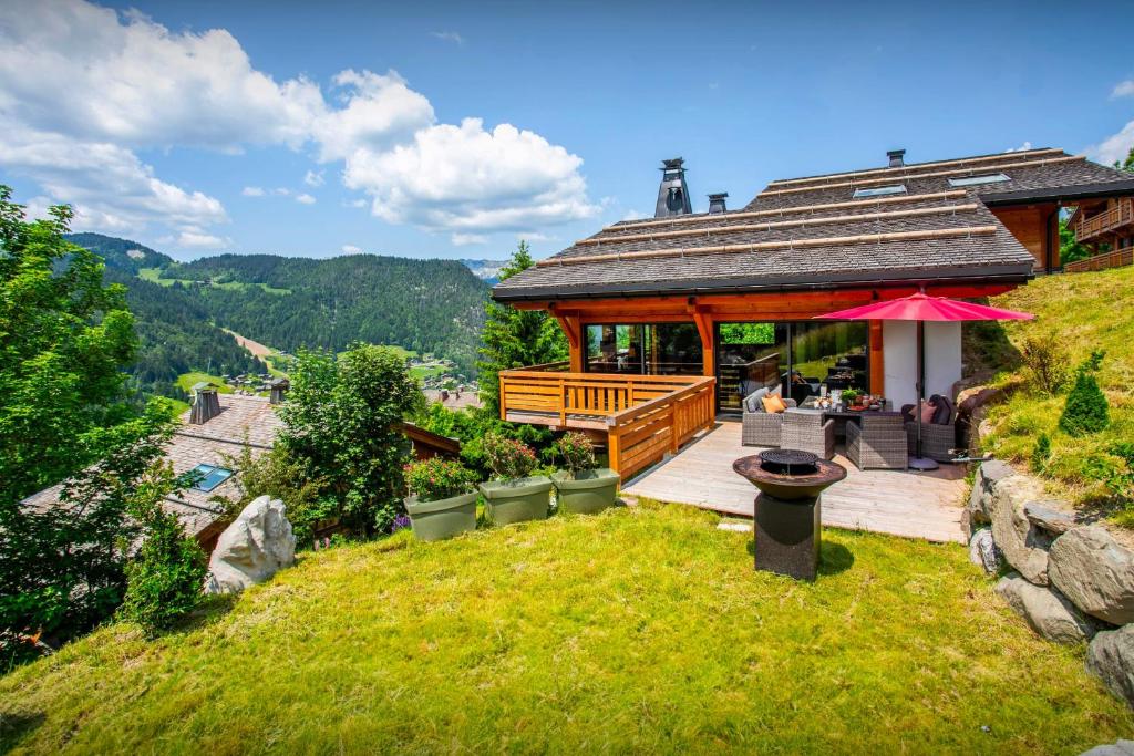 a building with a restaurant on a hill at Chalet Bella Cha - OVO Network in La Clusaz