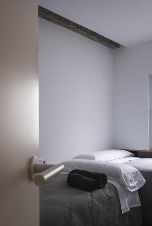 Postel nebo postele na pokoji v ubytování WISH SUITE AZAHAR DE SEVILLA
