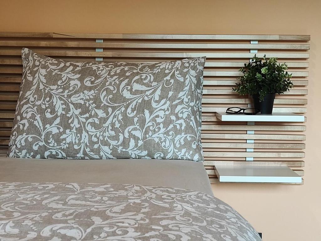 En eller flere senge i et værelse på Desideria Rooms Bed and Breakfast