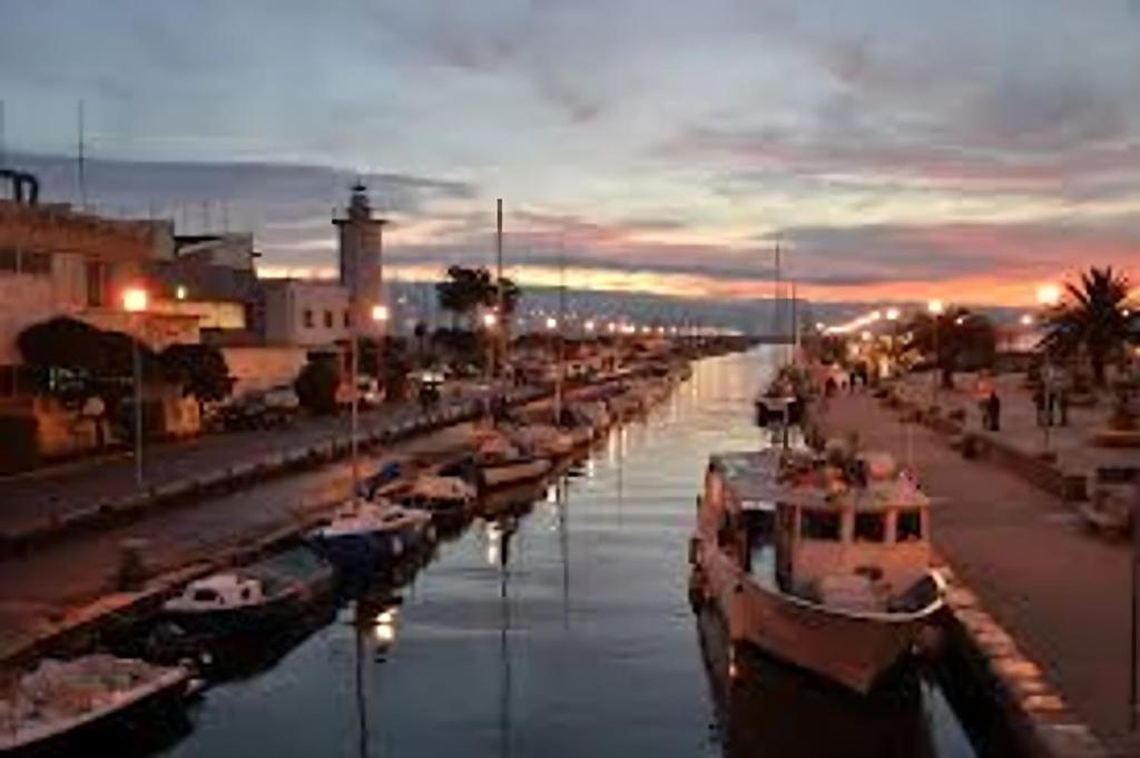 a group of boats docked in a harbor at night at Villa Valentina Versilia in Viareggio