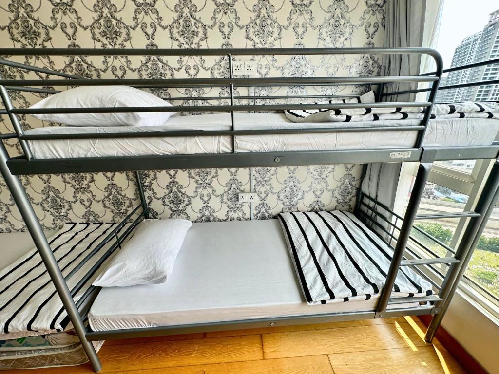 Postel nebo postele na pokoji v ubytování Comfy+ by ARH KLCC