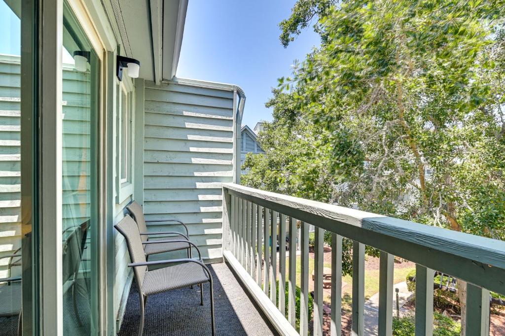 a balcony with a chair on the side of a house at Myrtle Beach Resort Condo - Walk to Beach! in Myrtle Beach