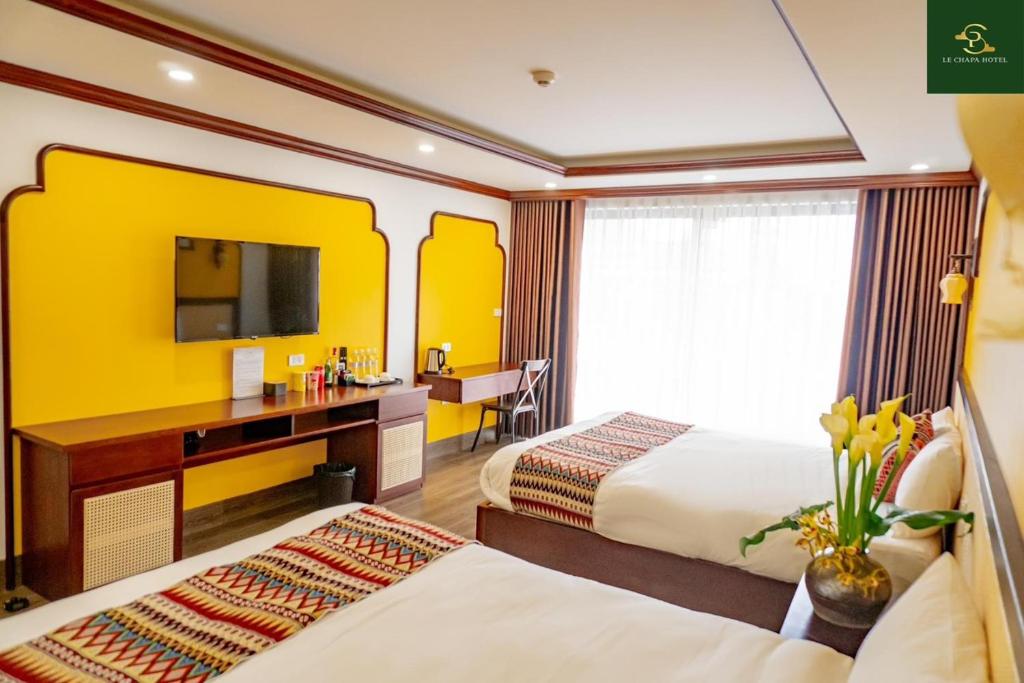 Postel nebo postele na pokoji v ubytování Le Chapa Hotel & Spa