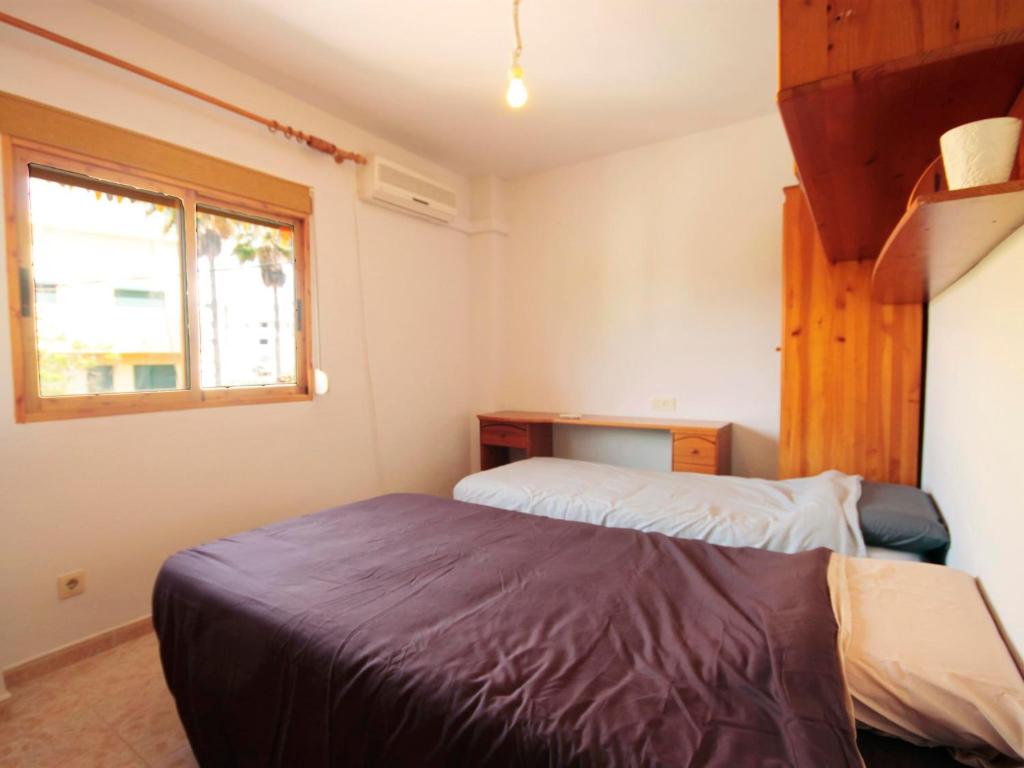 Postel nebo postele na pokoji v ubytování Saladar 7