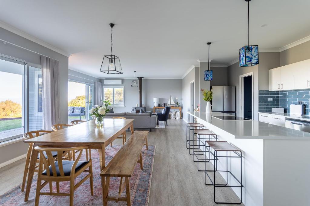 a kitchen and living room with a table and chairs at Belvoir - Denmark in Denmark