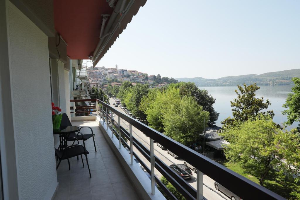 a balcony with a view of a river at Nana's & Pepi's House in Kastoria