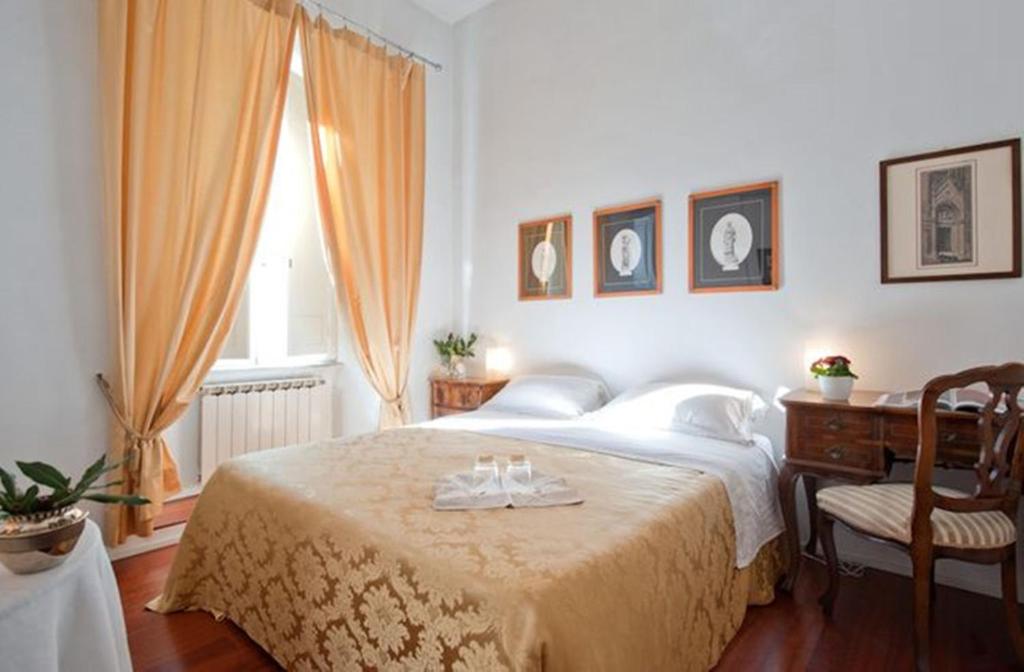 Postel nebo postele na pokoji v ubytování B&B Colori di Roma