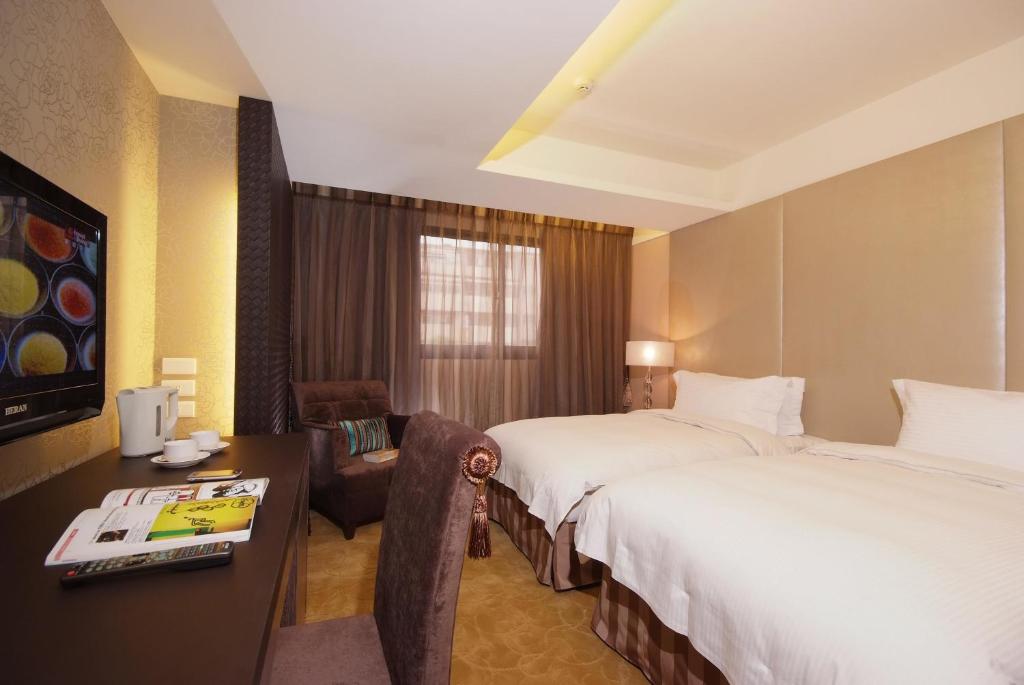 Postel nebo postele na pokoji v ubytování The Metro Hotel - Taipei Branch