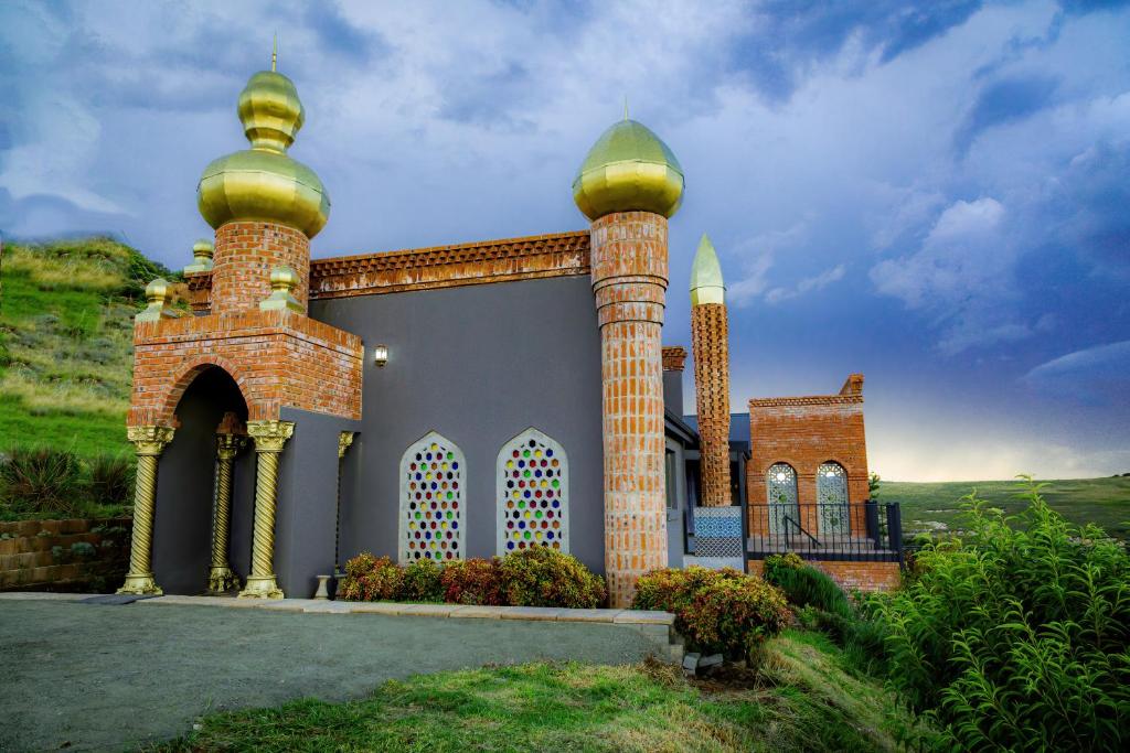 a building with two large towers on top of it at Castle in Clarens in Clarens