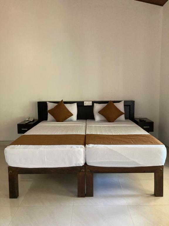 Letto o letti in una camera di The View Hotel Sigiriya