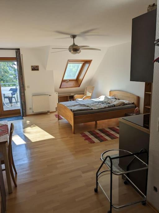 a living room with a bed and a table at Apartment in Ludwigsburg in Ludwigsburg