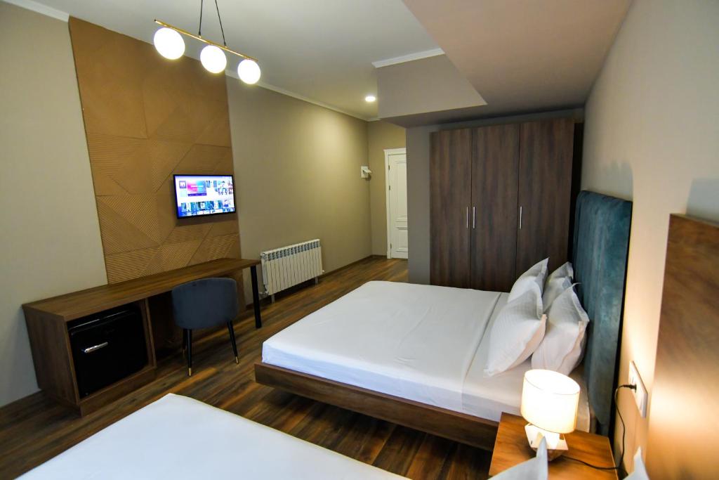 Postel nebo postele na pokoji v ubytování Gelati Residence