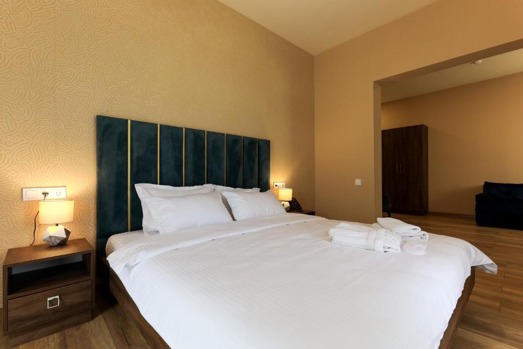Postel nebo postele na pokoji v ubytování Gelati Residence