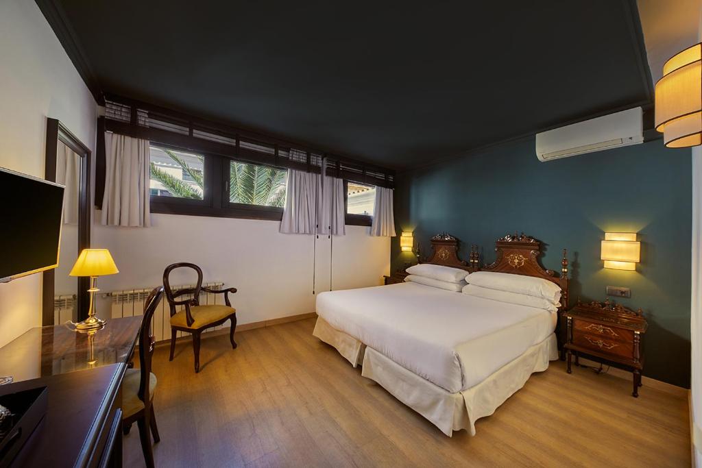 Postel nebo postele na pokoji v ubytování Hotel Born