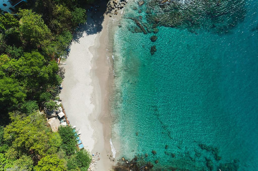 an overhead view of a beach and the ocean at Cap Maison Resort & Spa in Cap Estate