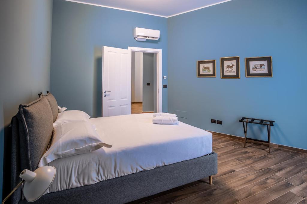 מיטה או מיטות בחדר ב-Palazzo Zippitelli Apartments