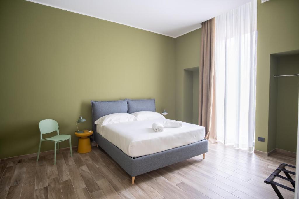 מיטה או מיטות בחדר ב-Palazzo Zippitelli Apartments