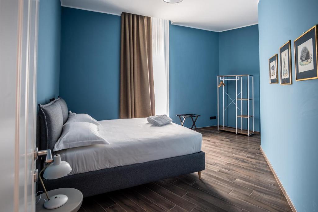 מיטה או מיטות בחדר ב-Palazzo Zippitelli Apartments