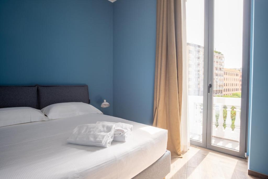 מיטה או מיטות בחדר ב-Palazzo Zippitelli Apartments