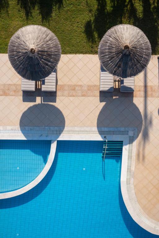 Bazén v ubytovaní Elèa Concept Hotel & Suites alebo v jeho blízkosti