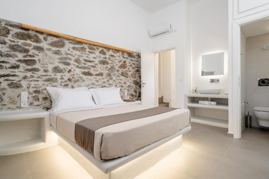 Postel nebo postele na pokoji v ubytování Bee Naxian House