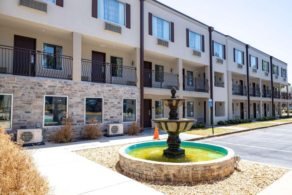 a fountain in front of a building at Baymont by Wyndham College Park Atlanta Airport South in Atlanta