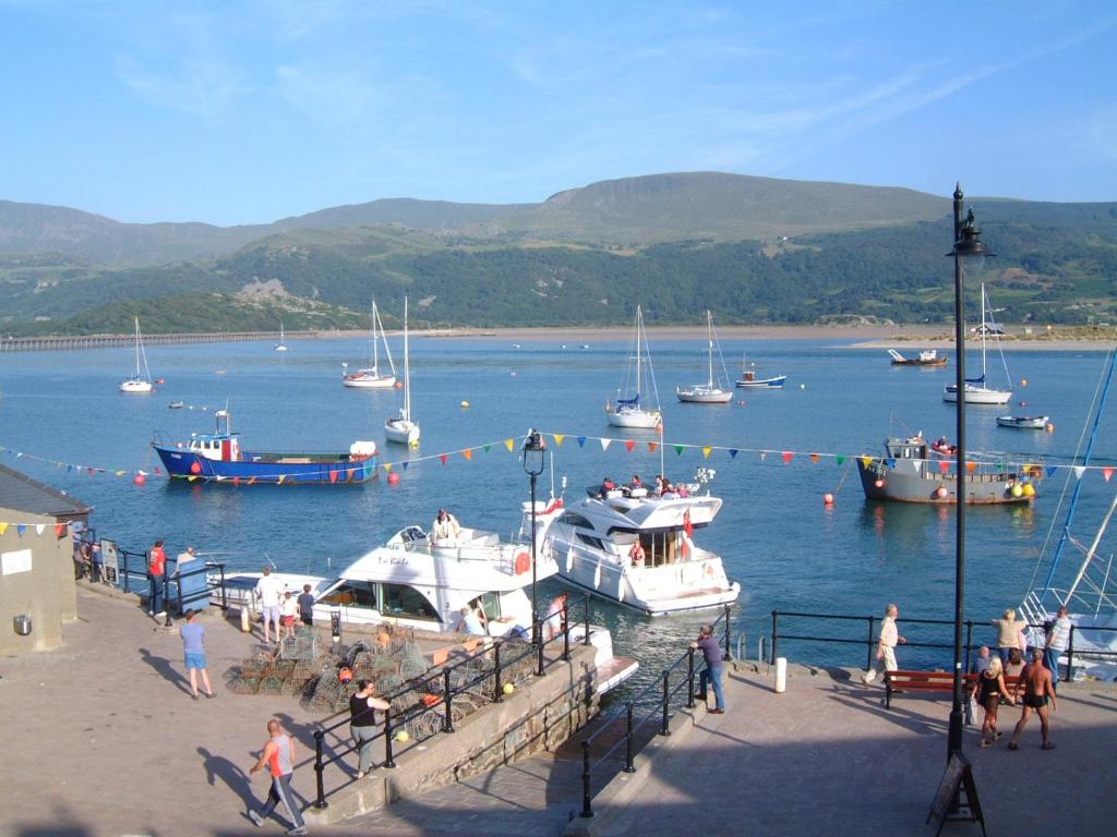 a group of boats in a body of water at Sunray Apartments in Barmouth
