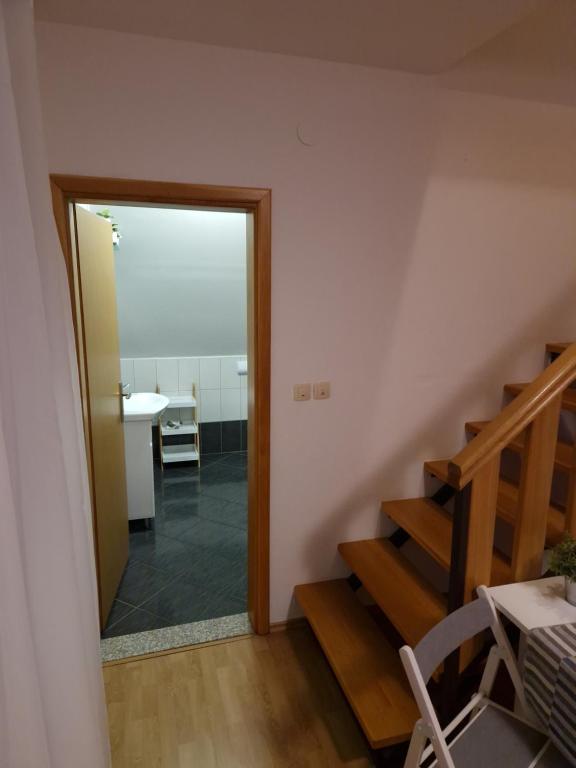 a hallway with a door leading into a room at Guest house Wolf II in Plitvička Jezera