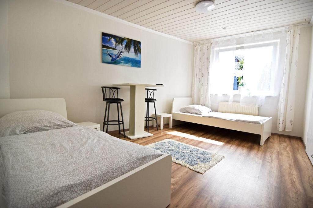Posteľ alebo postele v izbe v ubytovaní cozy worker apartments Niederkassel