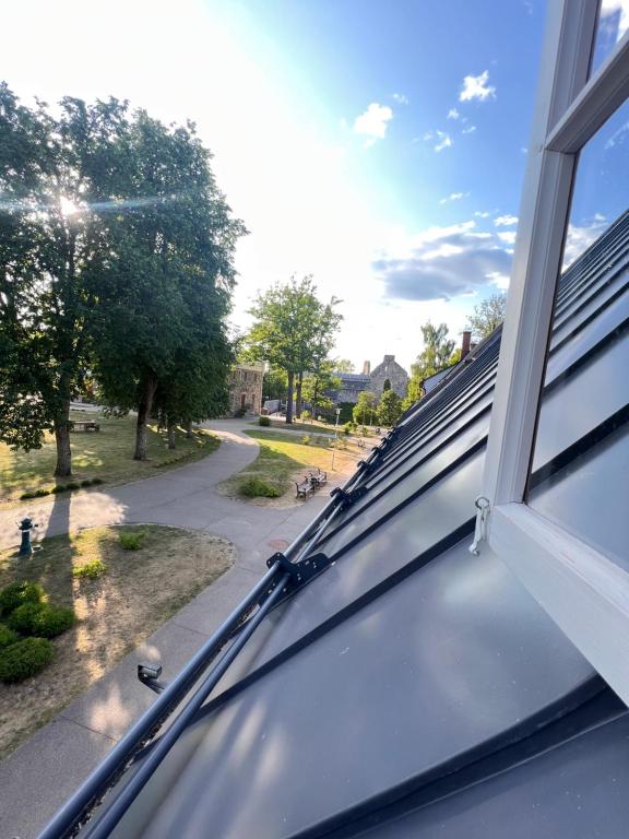 an open window with a view of a street at Rezidence Wannas Self Check in in Sigulda