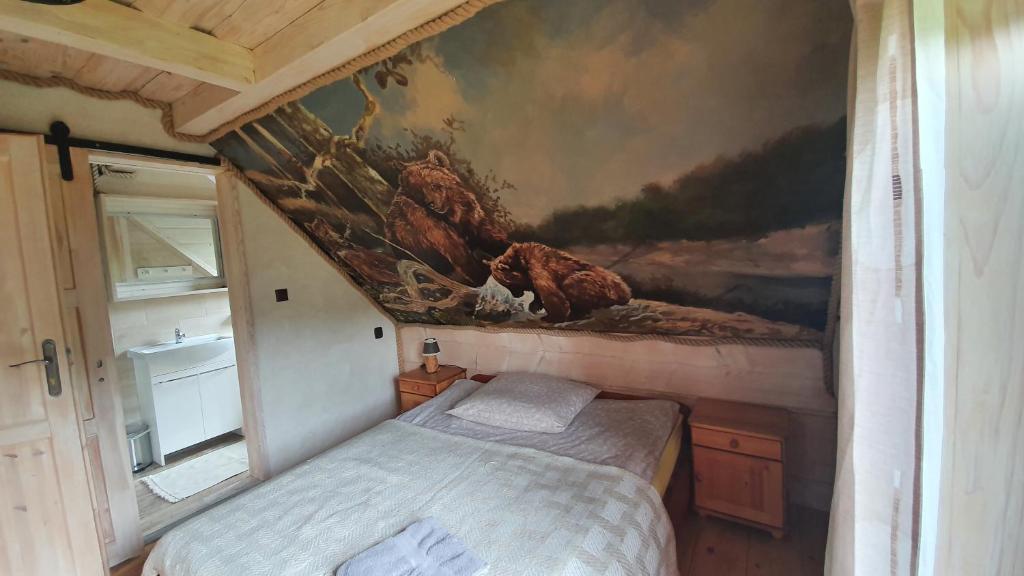 Postel nebo postele na pokoji v ubytování Bieszczady Domki w Dolinie Sanu