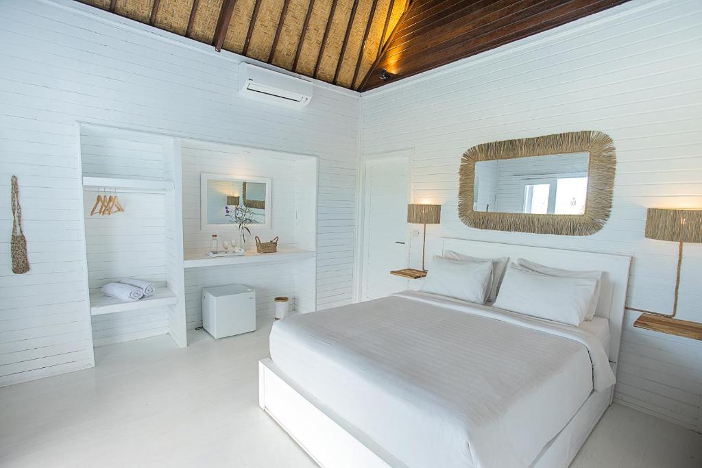 Postel nebo postele na pokoji v ubytování Stardust Villas
