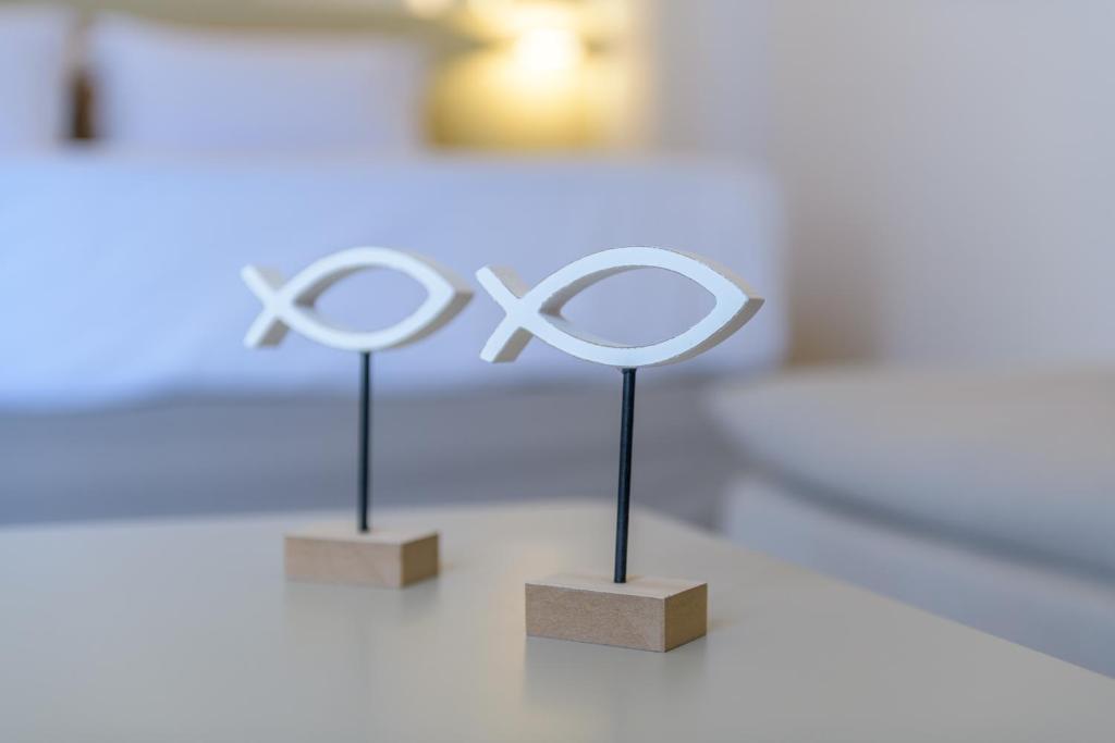 Postel nebo postele na pokoji v ubytování Vivere Luxury Suites