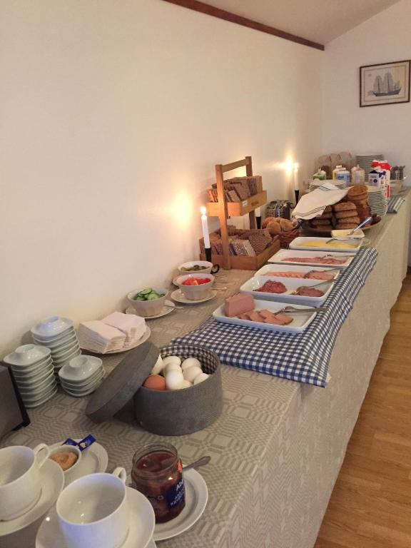 Postel nebo postele na pokoji v ubytování Hotell Fisketången