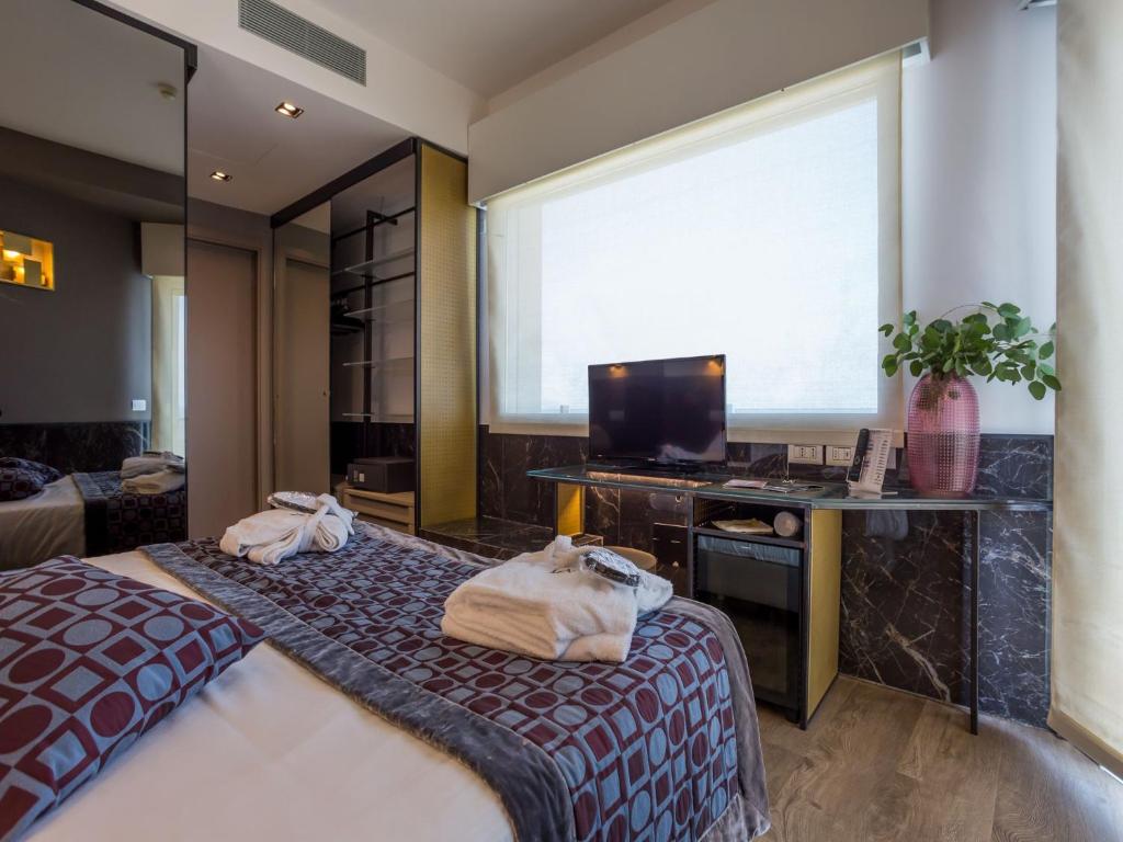TV a/nebo společenská místnost v ubytování Hotel Michelangelo