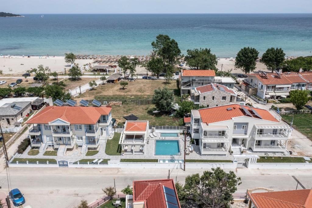 an aerial view of a house and the beach at Sole Mare in Chrysi Ammoudia
