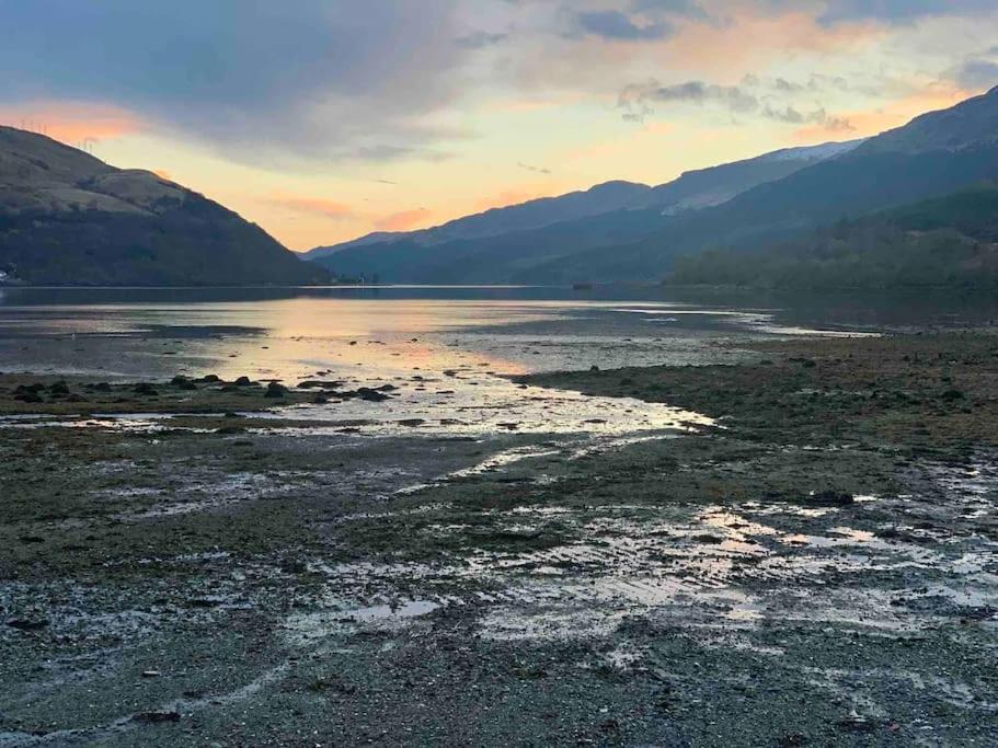 a large body of water with mountains in the background at Cottage on the Loch in Arrochar