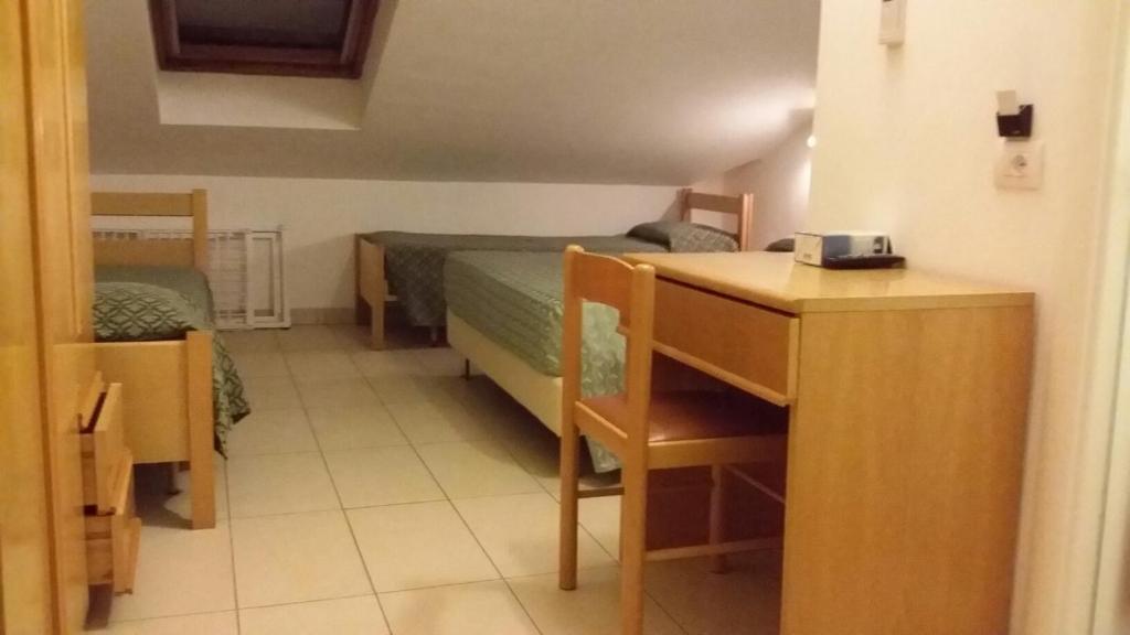 Postel nebo postele na pokoji v ubytování Hotel Matteo
