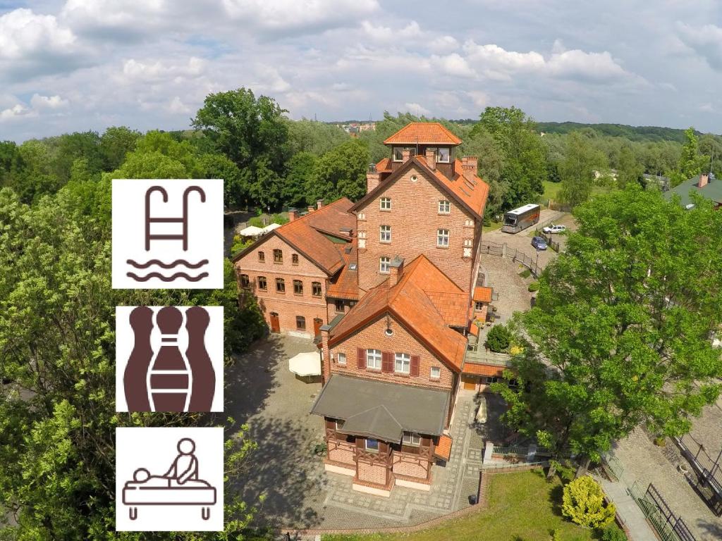 an aerial view of a large house with a sign at Hotel Młyn Aqua Spa in Elblag