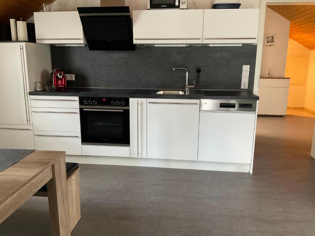 Kuchyň nebo kuchyňský kout v ubytování Apartment Auszeit