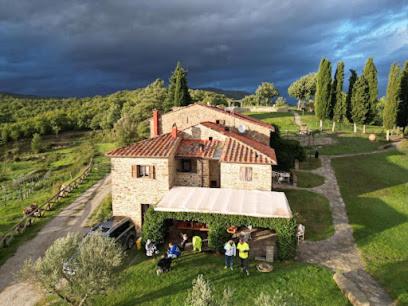 a group of people standing in front of a house at Agriturismo D'ambiano in Arezzo