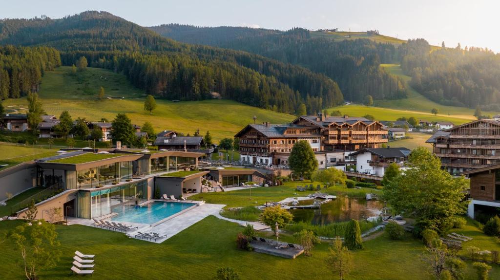 an aerial view of a village with a resort at Naturresort PURADIES in Leogang