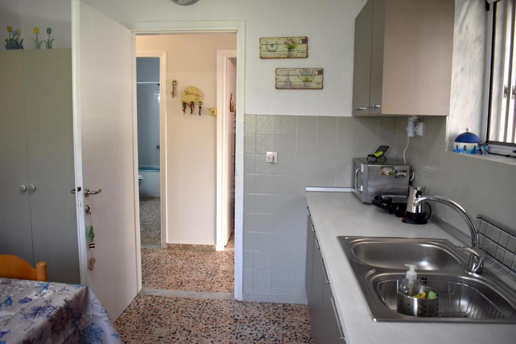 Kuchyň nebo kuchyňský kout v ubytování Tim's House