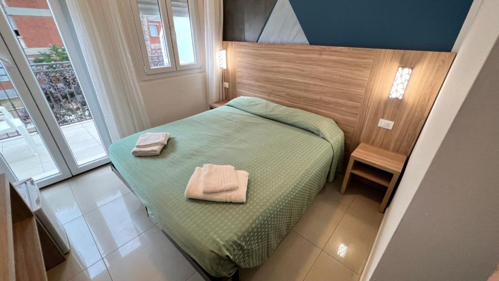 Postel nebo postele na pokoji v ubytování Club Vacanze In