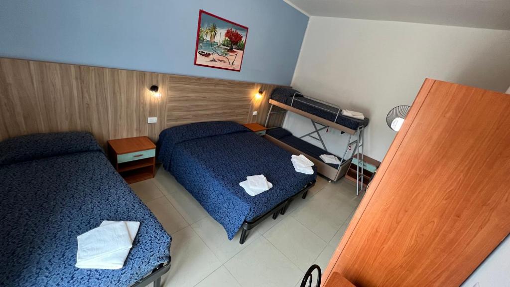 Postel nebo postele na pokoji v ubytování Club Vacanze In